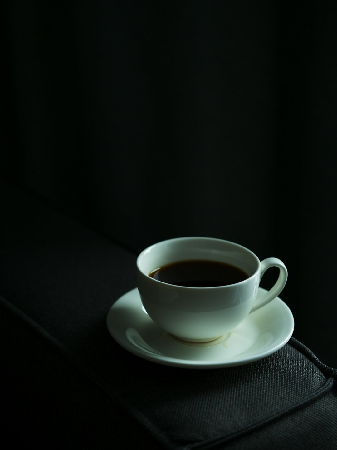 a-cup-of-coffee-sitting-on-top-of-a-saucer-yhdmx6uogco